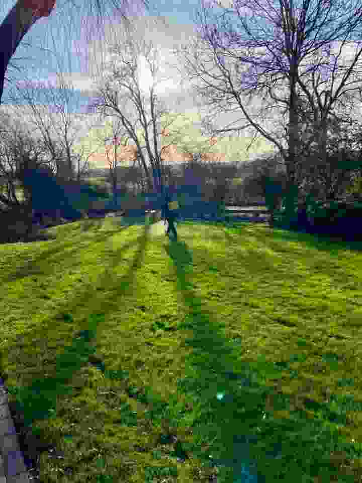 This image has been taken on a lovely winters day with a lawn care service underway. One of our lawn experts can be seen in the background carrying out a lawn service 