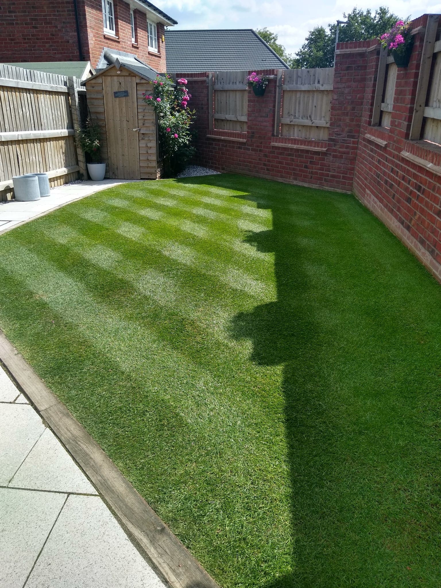This image is of a small striped lawn in Lichfield which is benefitting from lawn services