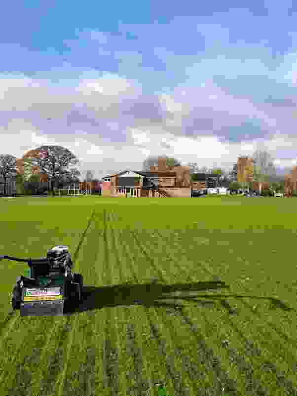 This image is of a larger grassed area undergoing an aeration as part of a lawn maintenance programme