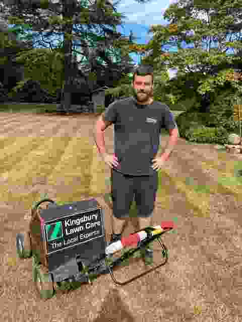 This image is of our latest lawn expert Mark with of our our specialist lawn aerators ready for action