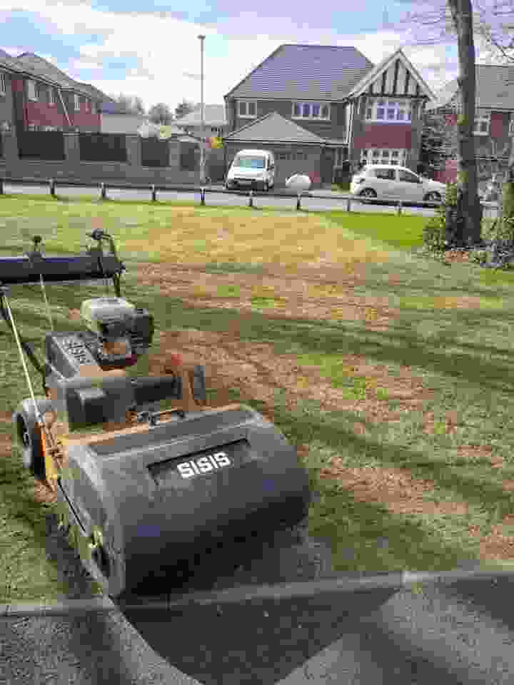 This image shows one of our scarifiers on a lawn undergoing a lawn renovation. As lawn renovators this is an impressive machine for lawns in need of repair