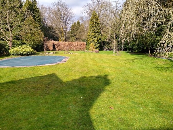 This image is of a large lawn in Sutton Coldfield in need of a lawn treatment service due to suffering from moss in the lawn