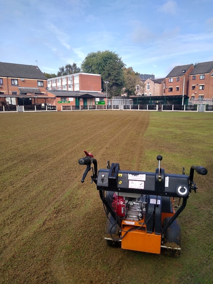 Kingsbury Lawn Care | Bowling green during the dethatching process with a powered scarifier 