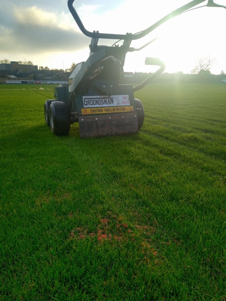 This image is of our best lawn aerator at work as part of our lawn services and to help tackle the issues which cause red thread disease